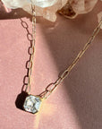 Close view of Asscher cut moissanite pendant necklace showing step cut sparkle - Camille Jewelry