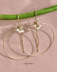 Gold filled threader hoop earrings with pearl accents on a pink background - Camille Jewelry