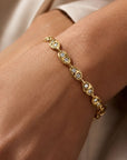 14K yellow Gold mariner bracelet with diamonds on models wrist by Camille Jewelry.