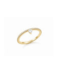 Standing side view of a skinny trillion pavé stacking ring in 18K Gold vermeil on a white background by Camille Jewelry