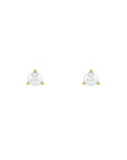 Tiny pearl studs in 14k yellow gold on a white background by Camille Jewelry
