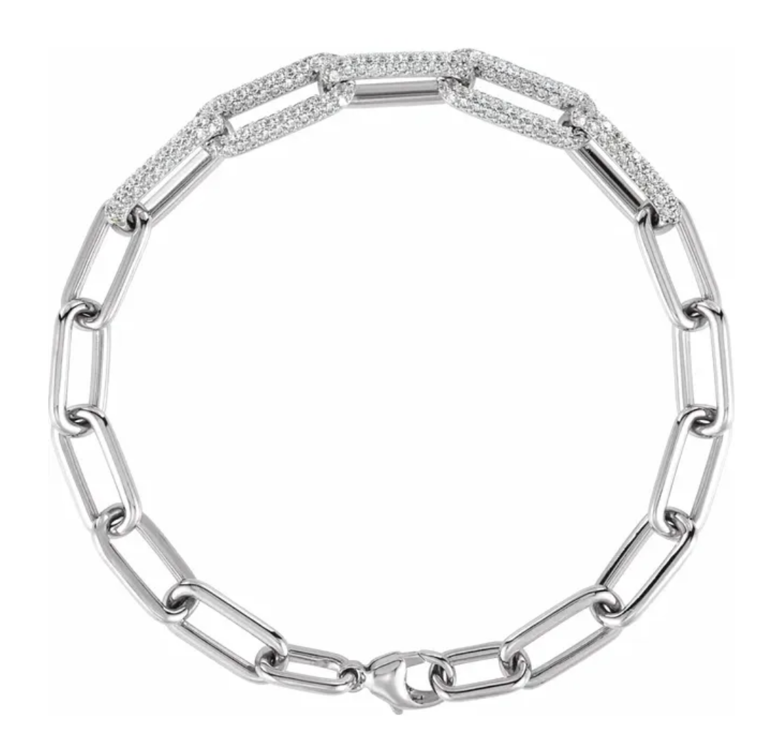 White gold paperclip bracelet with diamond accents on a white background by Camille Jewelry.