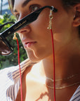 Red Magnetic Cord Strap Necklace For Eyewear Women's, Men's, Kids on a model with glasses- Camille Jewelry