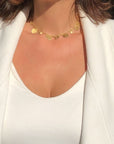 Gold plated disc charm convertible necklace double wrapped as a choker by Camille Jewelry.