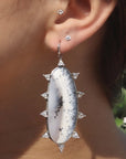Model wearing Dendritic Opal Starburst Earrings in sterling silver - Camille Jewelry