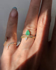 Diamond & Gold Pinky Ring for Women on hand model wearing other emerald and diamond ring stacks by Camille Jewelry.