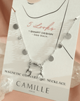 Silver plated disc charm convertible necklace and eyeglass chain on a card by Camille Jewelry.