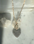 Amethyst Druzy Quartz Heart Pendant Necklace on a quartz display|- Camille Jewelry
