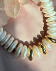 Close up of hand knotted freshwater pearls and 14K gold filled sphere beads on silk thread by Camille Jewelry