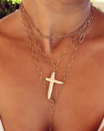 Woman wearing a gold Figaro necklace in 14K gold filled by Camille Jewelry