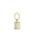 Lab grown diamond charm in 14K yellow gold with a bezel set stone on a white background angled view by Camille Jewelry
