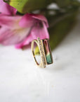 Diamond Bar Tourmaline Gemstone Ring with flower in the background - Camille Jewelry