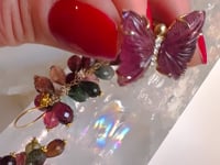 Video featuring pink hand carved tourmaline butterfly with diamond center in 14K yellow gold | Camille Jewelry