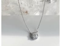 Solitaire diamond necklace with halo on a delicate chain in white gold. Rotating product style on a quartz stone | Camille Jewelry