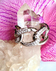 Silver Large Pave Cuban Link Ring on a flower and quartz display - Camille Jewelry