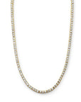 Modern tennis necklace in gold plated sterling silver with cubic zirconia on a white background by Camille Jewelry