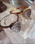 Gold & Silver Trillion Stackable Rings on a quartz display– Concave Pavé Everyday Bands - Camille Jewelry