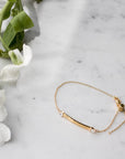 Gold Vermeil Women’s ID Bracelet on a marble display– Customizable Jewelry in Gold & Silver - Camille Jewelry