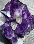 Gold Trillion Stud Earrings – Concave Pavé Sparkle on an amethyst display- Camille Jewelry