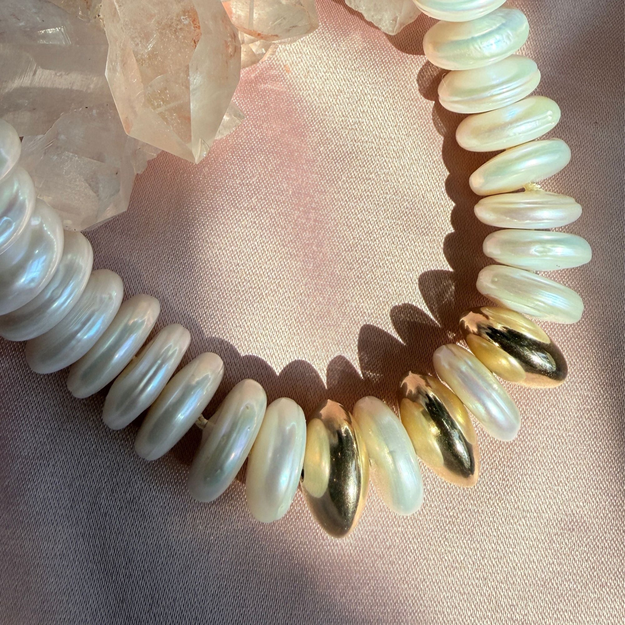 Close up of hand knotted freshwater pearls and 14K gold filled sphere beads on silk thread by Camille Jewelry