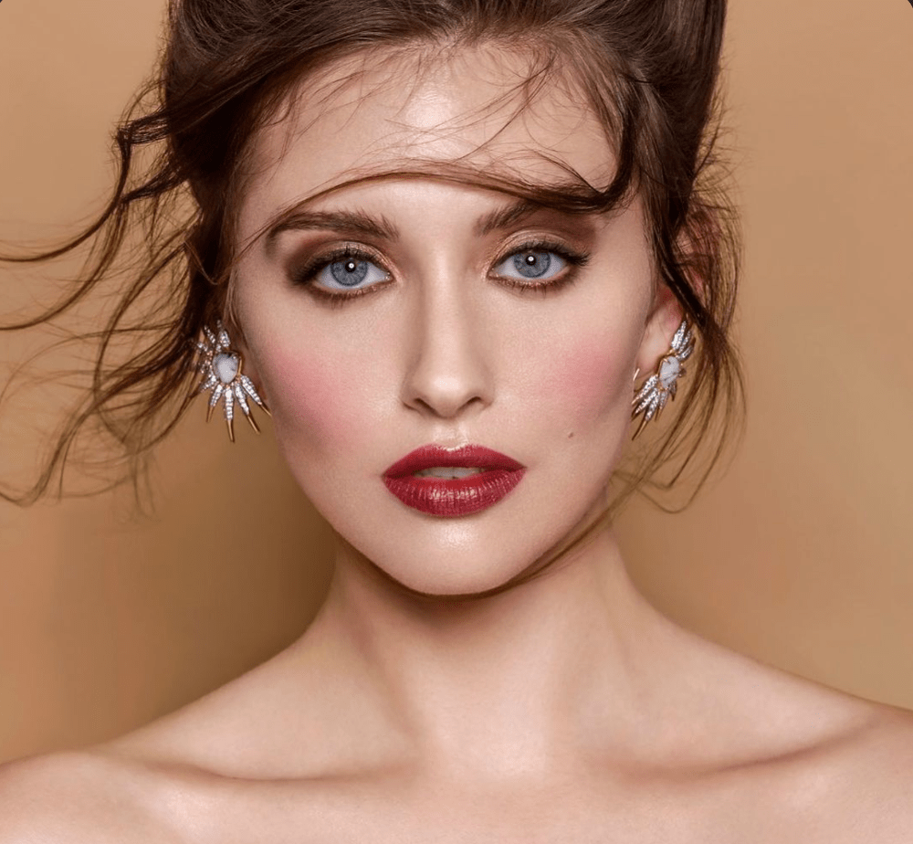 Fashion Jewelry with statement earring on model by Camille Jewelry