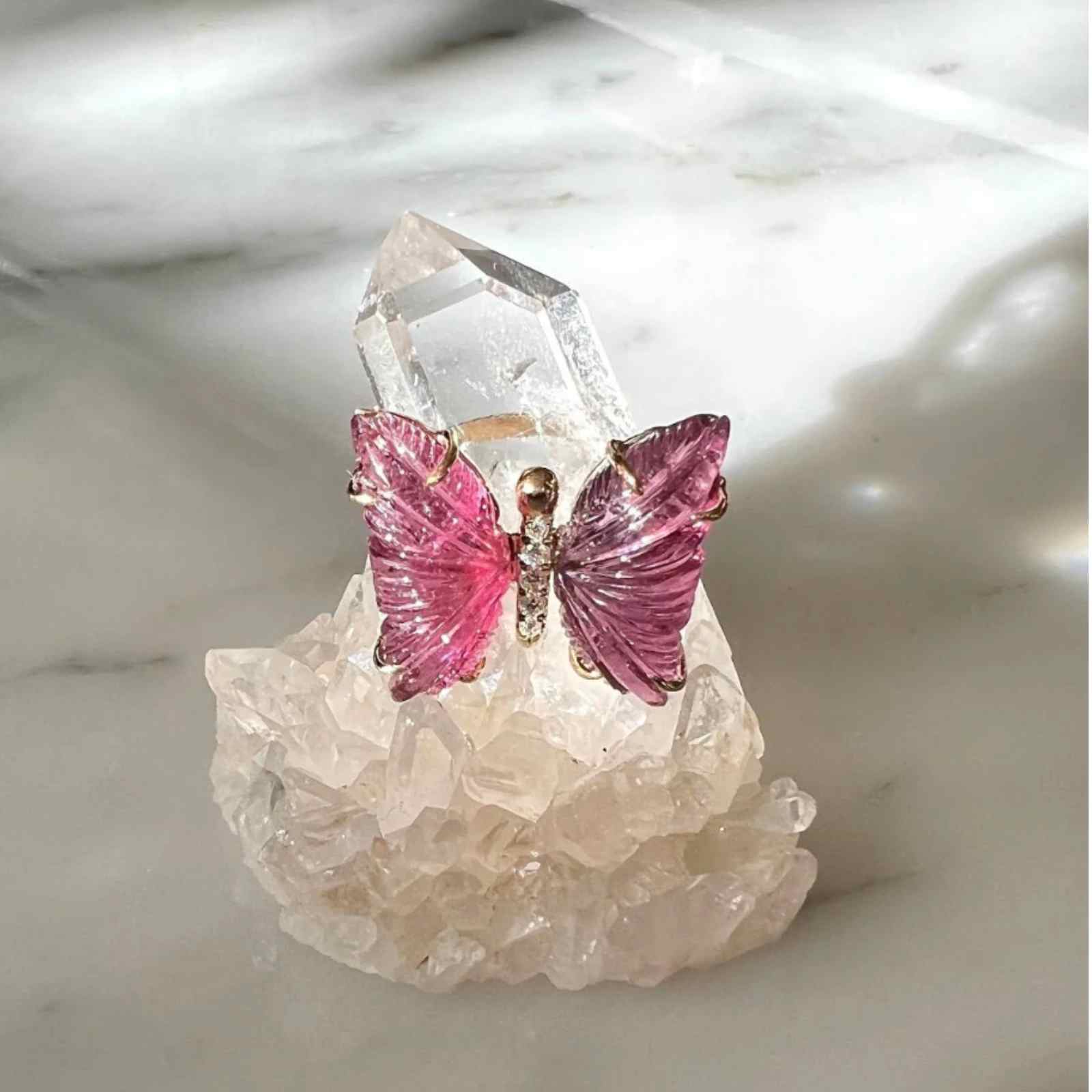 Pink tourmaline and diamond ring on crystal stone by Camille Jewelry