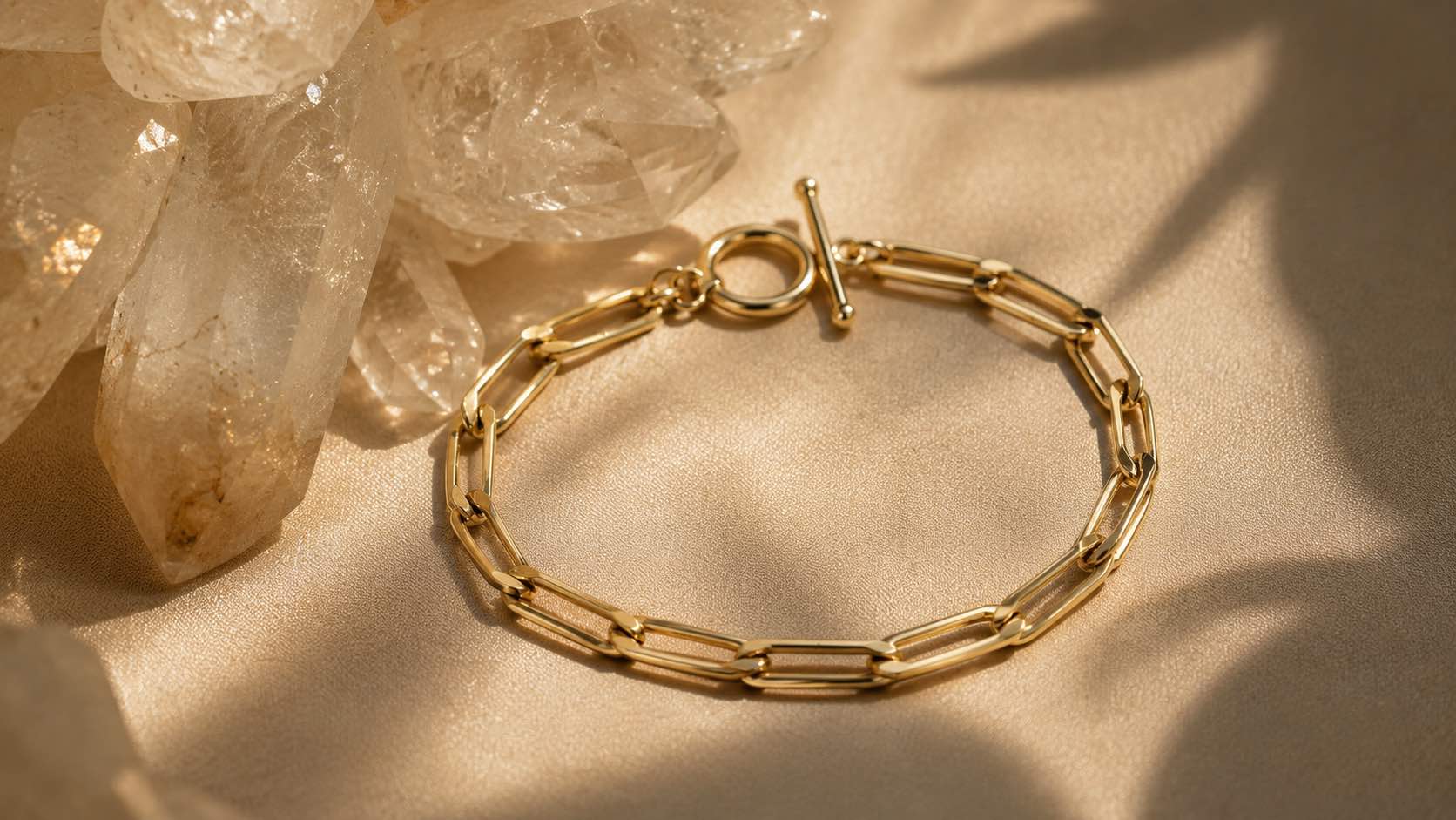 14kt gold filled elongated curb chain bracelet on soft beige background by Camille Jewelry