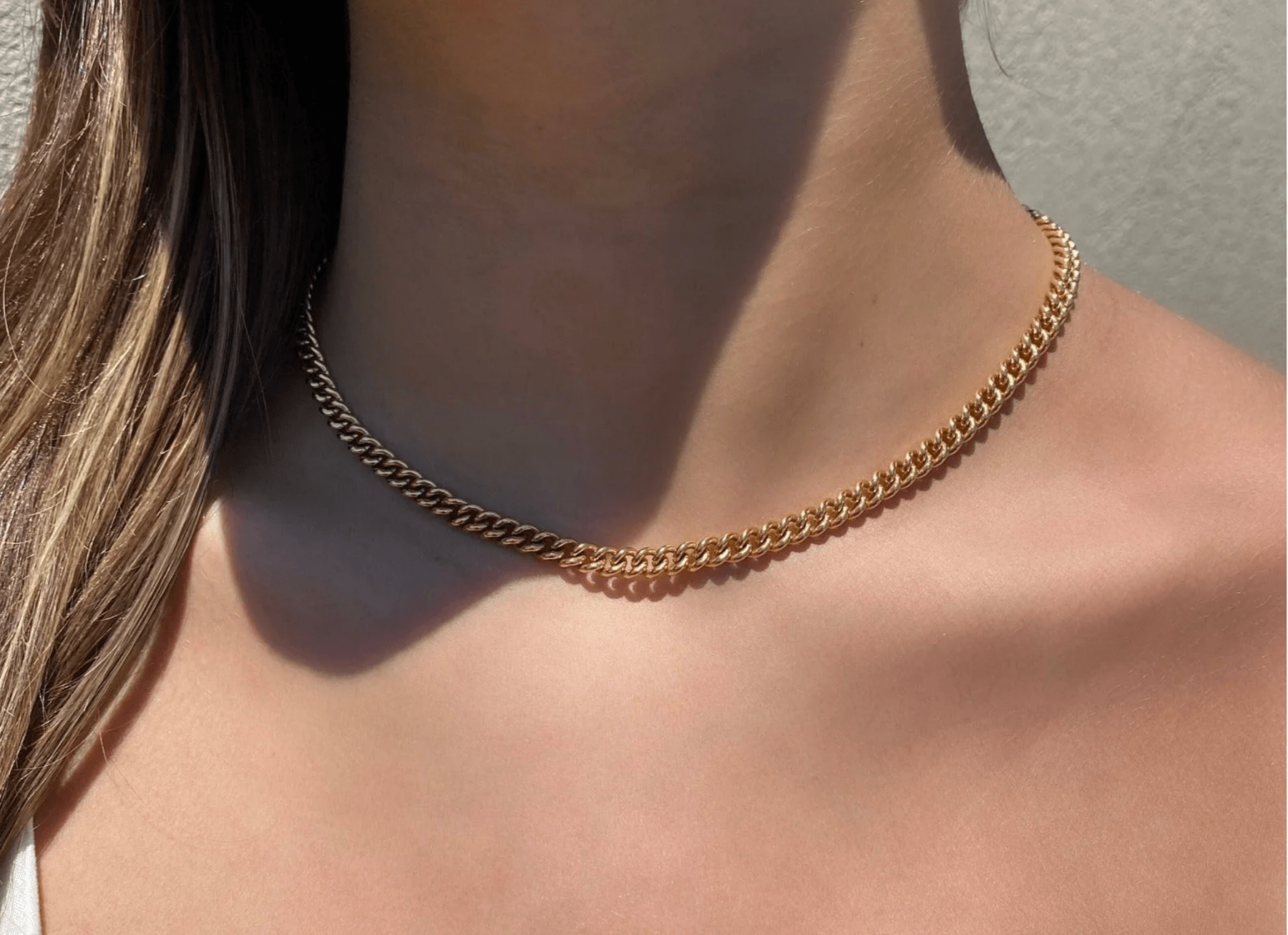 Gold Necklaces on models neckline- Camille Jewelry
