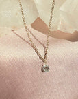 14K Gold Drilled Diamond Necklace ono a quartz and soft pink background - Camille Jewelry
