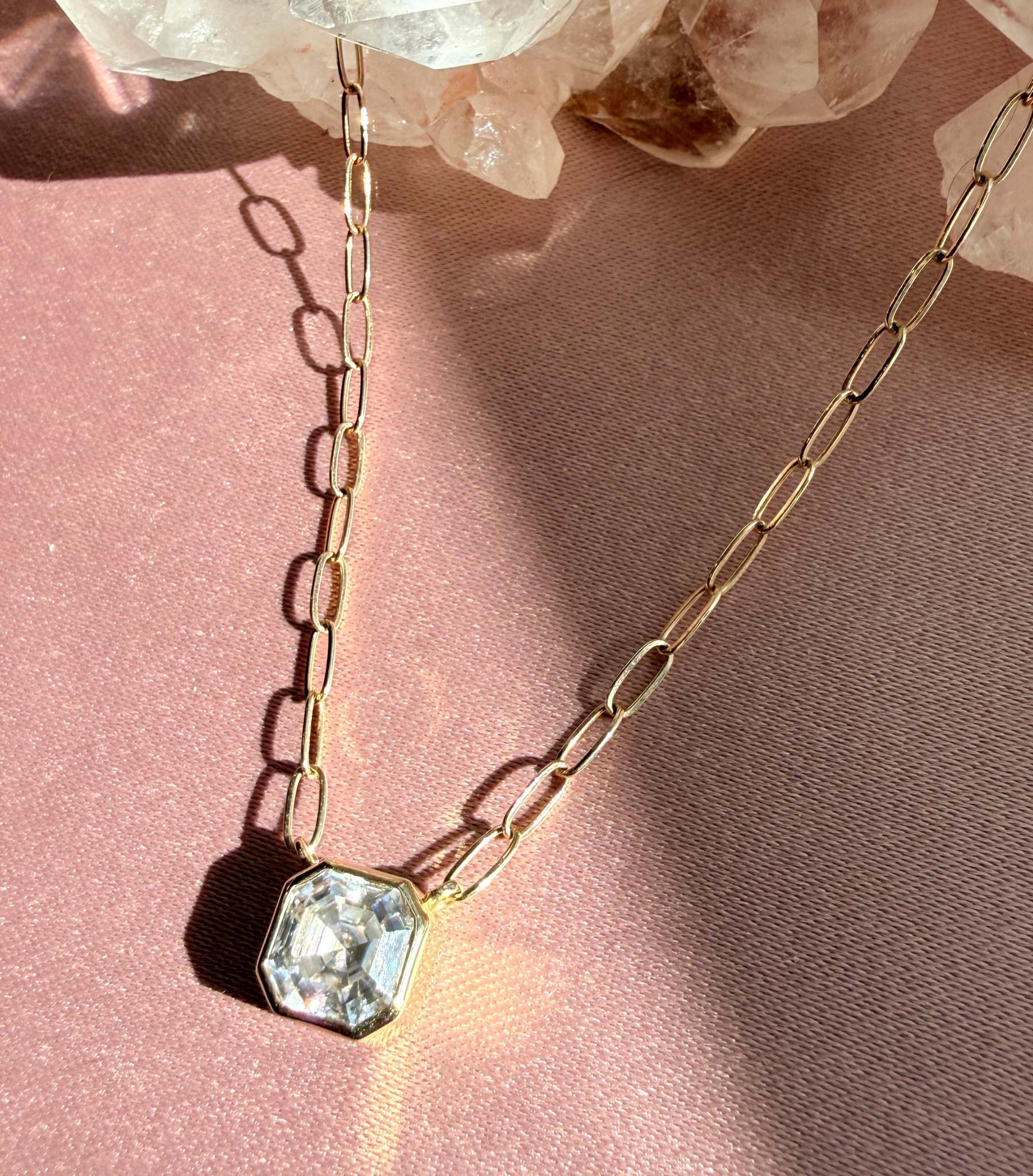 Close view of Asscher cut moissanite pendant necklace showing step cut sparkle - Camille Jewelry