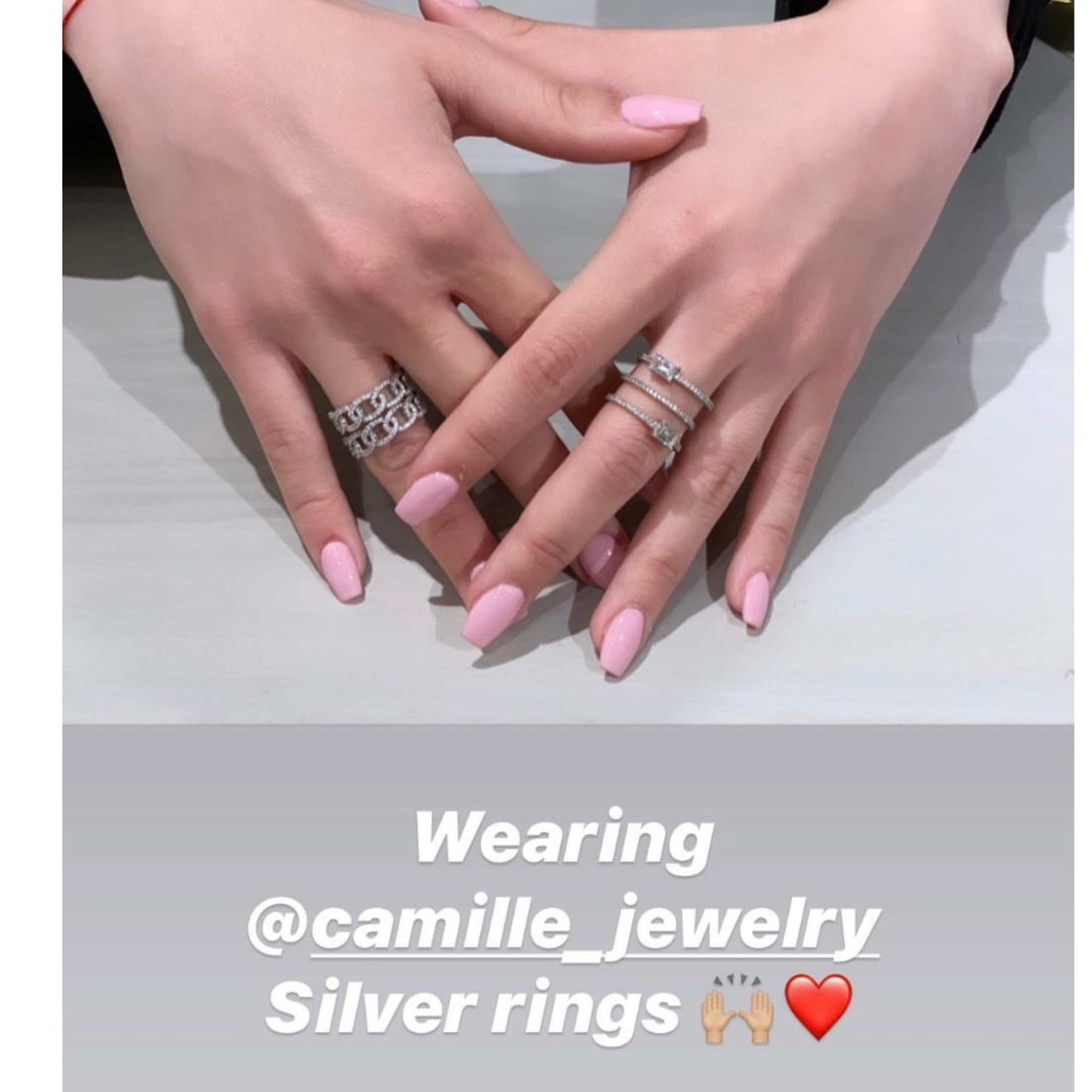 Sterling silver pave rings worn on customers hand posing - Camille Jewelry