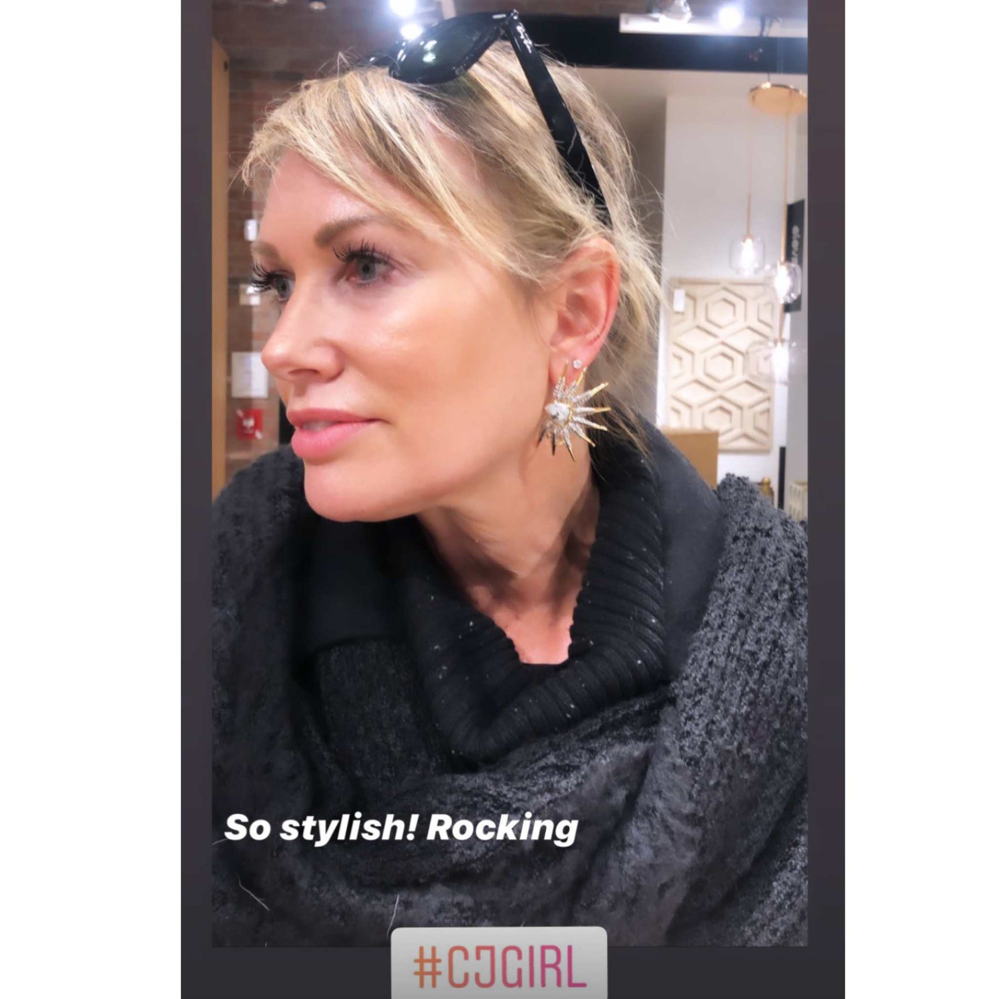 Phoenix wing statement earring on blong woman with posing - Camille Jewelry