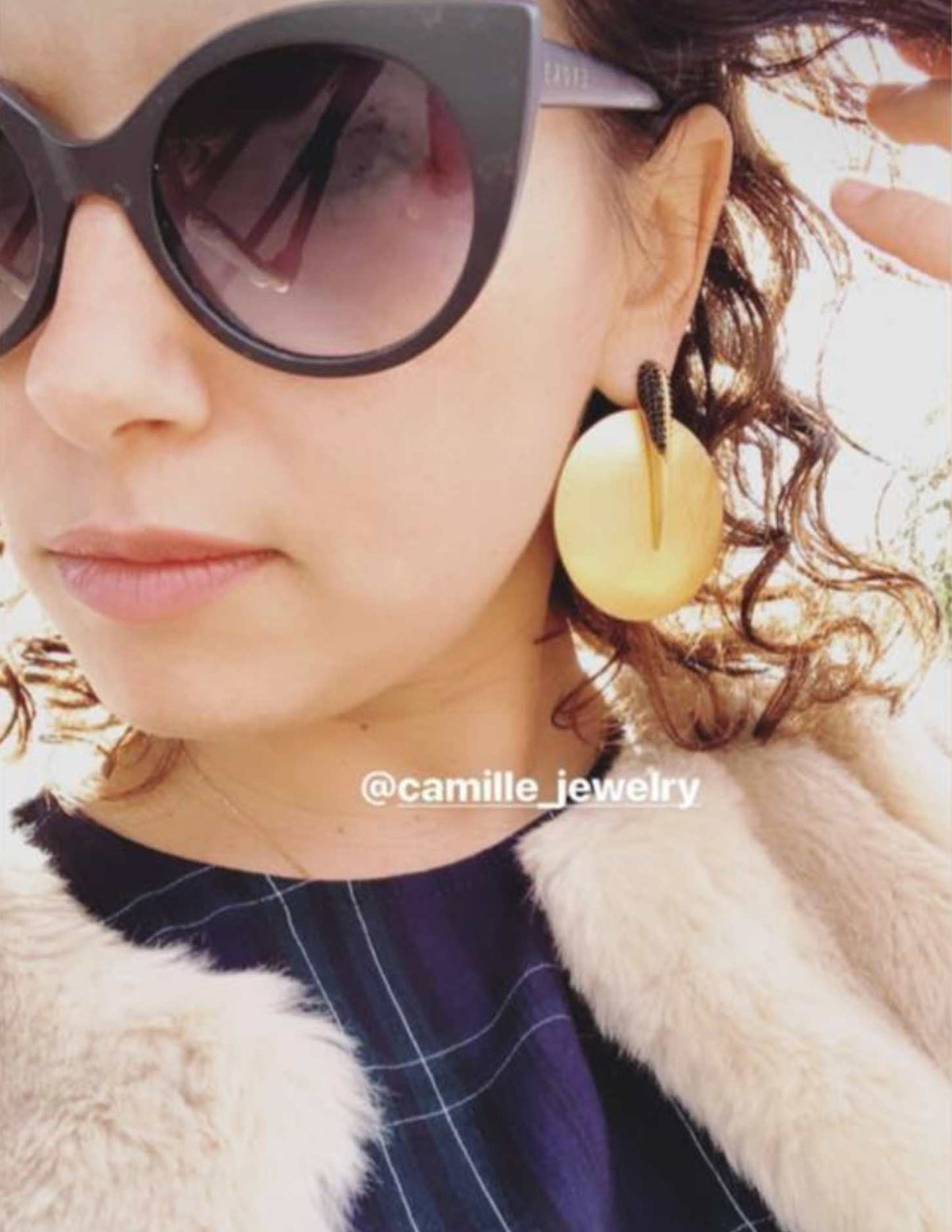 Disk phoenix earrings close up of woman wearing dark sunglasses - Camille Jewelry