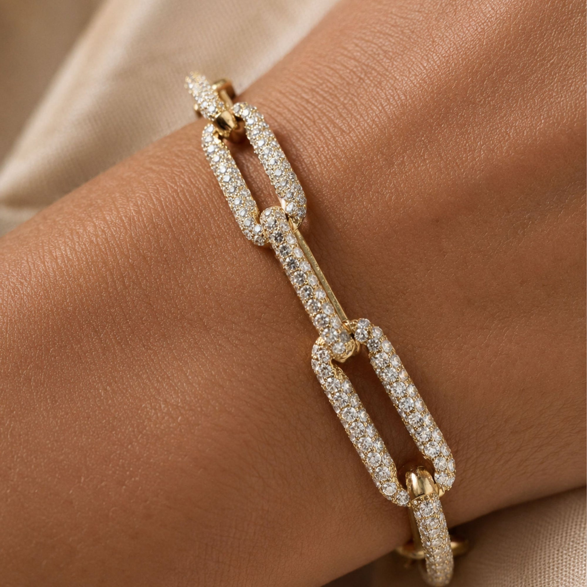 Gold paperclip bracelet in 14K yellow gold in lab created diamonds on wrist by Camille Jewelry