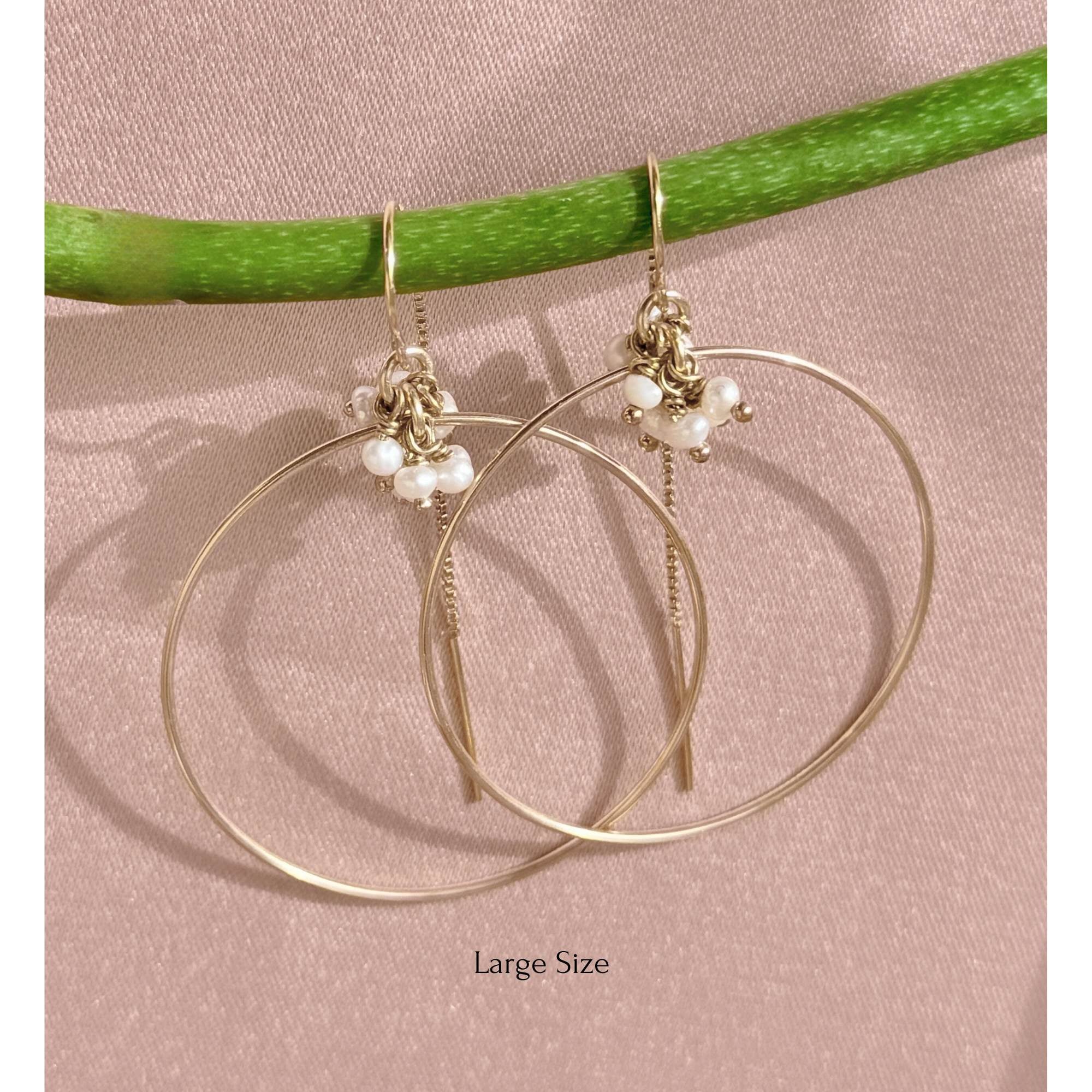 Gold filled threader hoop earrings with pearl accents on a pink background - Camille Jewelry