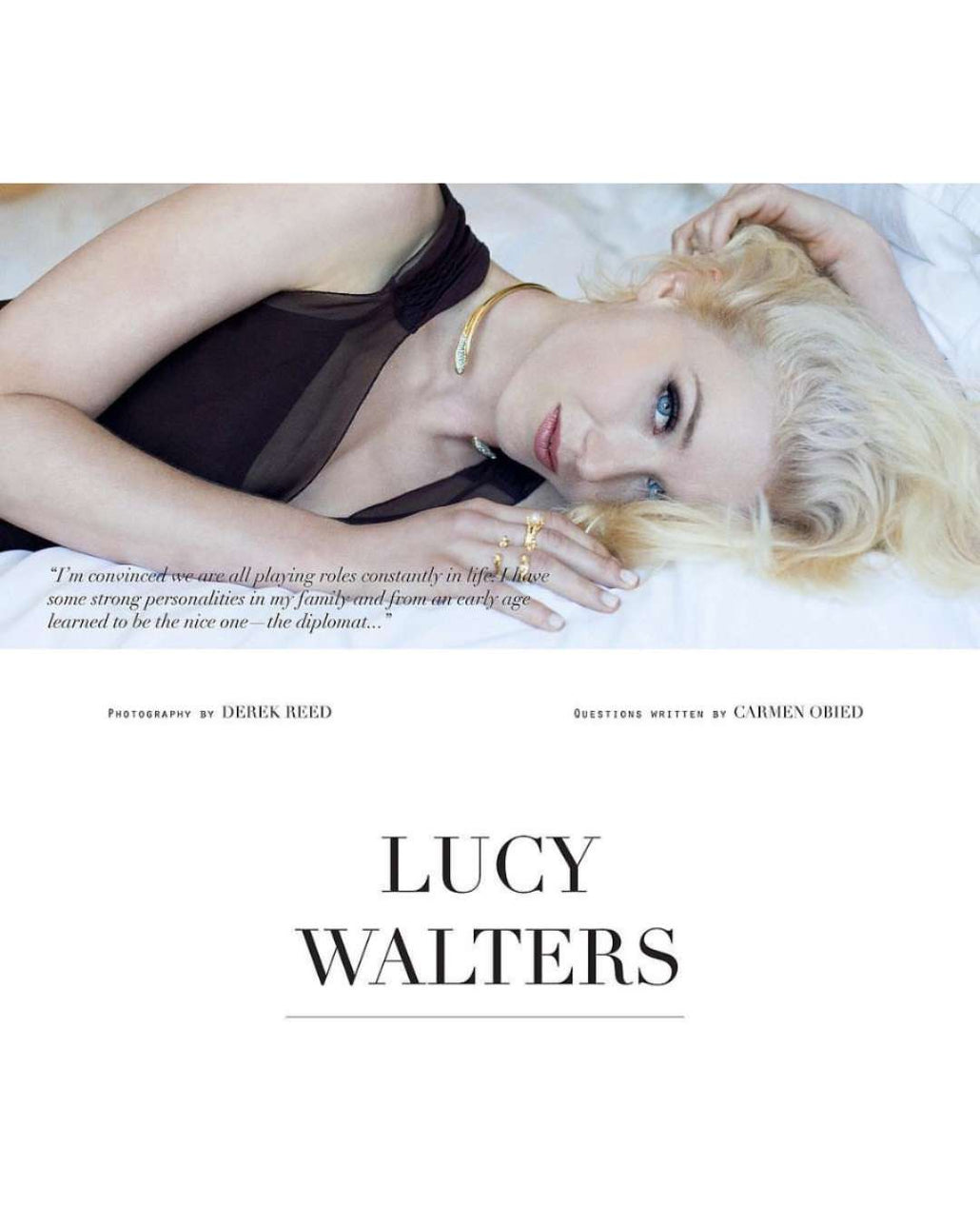 Lucy Walters lying on a white surface in gold jewelry rings and necklace with text overlay wearing Camille Jewelry.