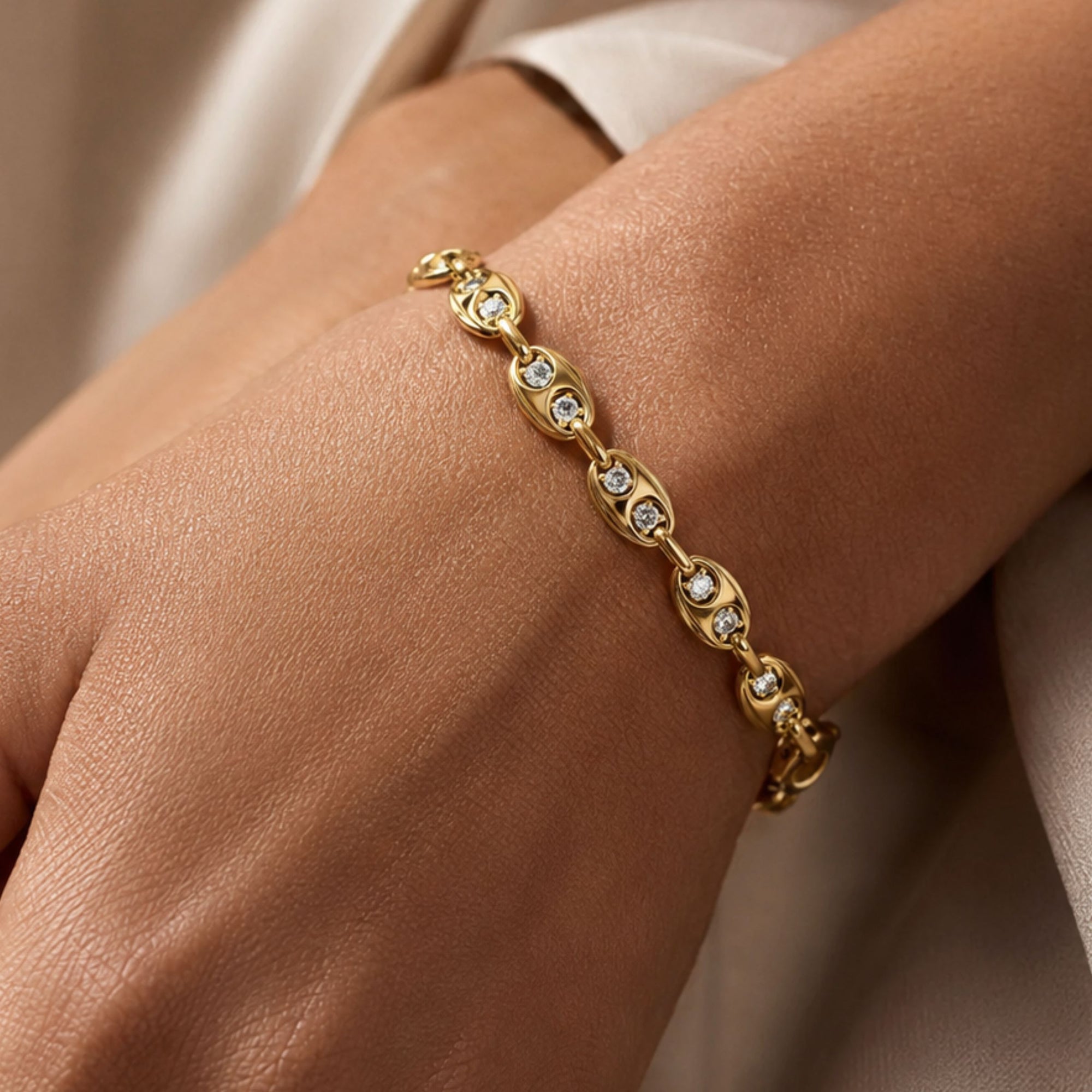 14K yellow Gold mariner bracelet with diamonds on models wrist by Camille Jewelry. 