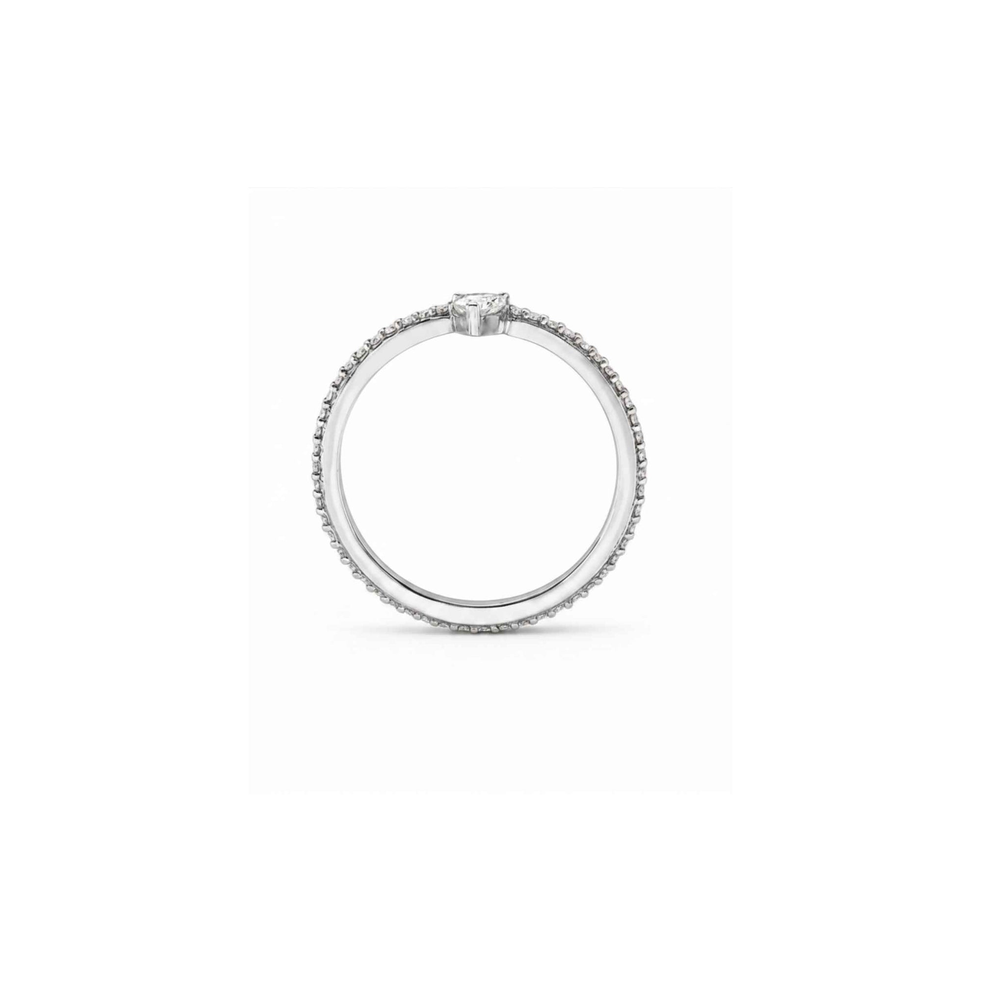 Standing side view of a skinny trillion pavé stacking ring in sterling silver on a white background by Camille Jewelry