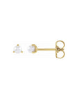 Tiny pearl stud earrings in 14K yellow gold on a white background by Camille Jewelry
