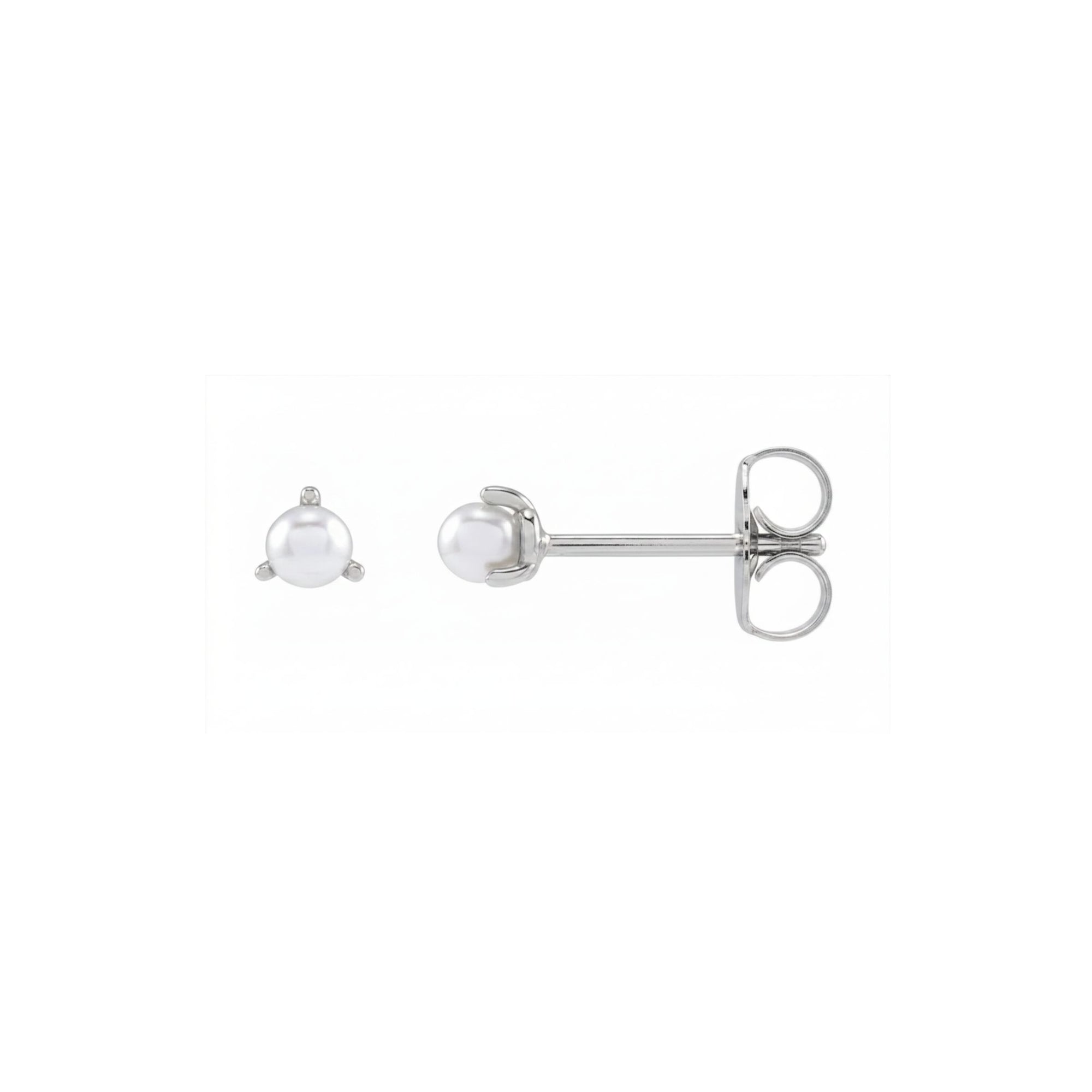Tiny pearl studs in 14K white gold side view on a white background by Camille Jewelry