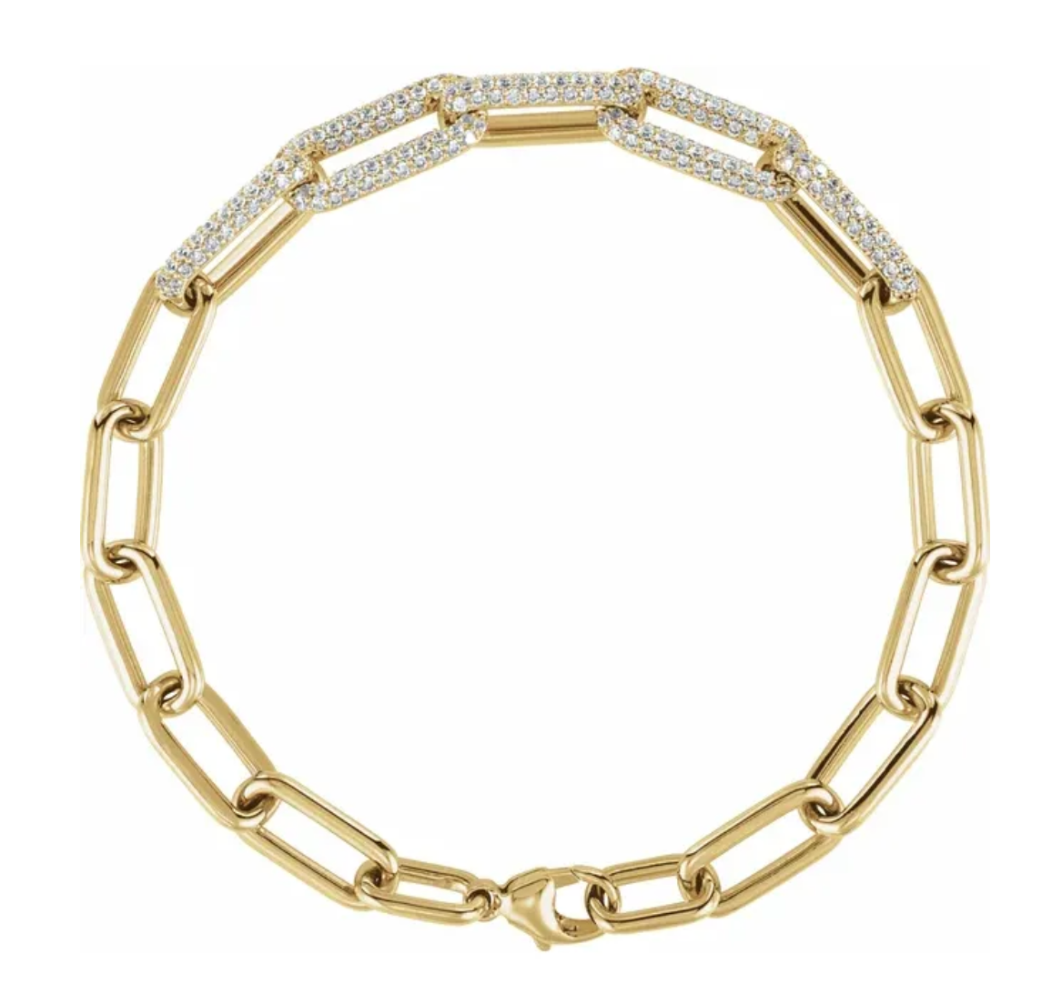 Gold chain bracelet with diamond accents on a white background by Camille Jewelry