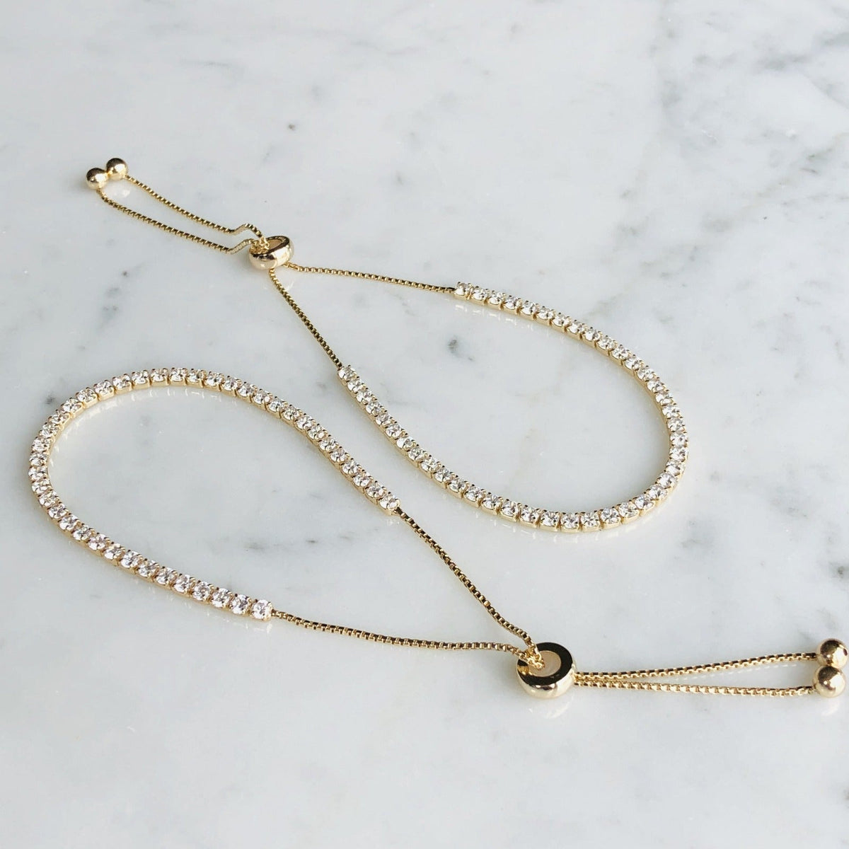 Gold plated Silver Casual Tennis Bracelet on quartz display- Camille Jewelry