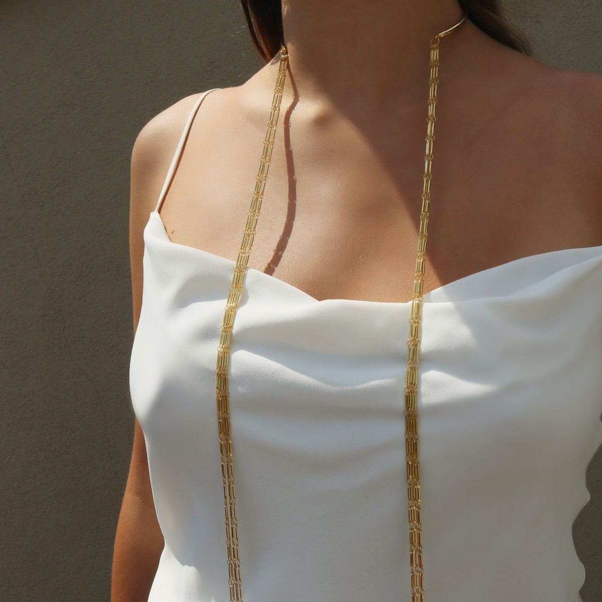 Anuket Gold Scarf Necklace with long chains on models neck– Versatile Layered Fashion Jewelry - Camille Jewelry