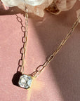 Close view of Asscher cut moissanite pendant necklace showing step cut sparkle - Camille Jewelry