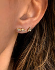 14K yellow gold tapered baguette diamond stud earrings on a model- Camille Jewelry