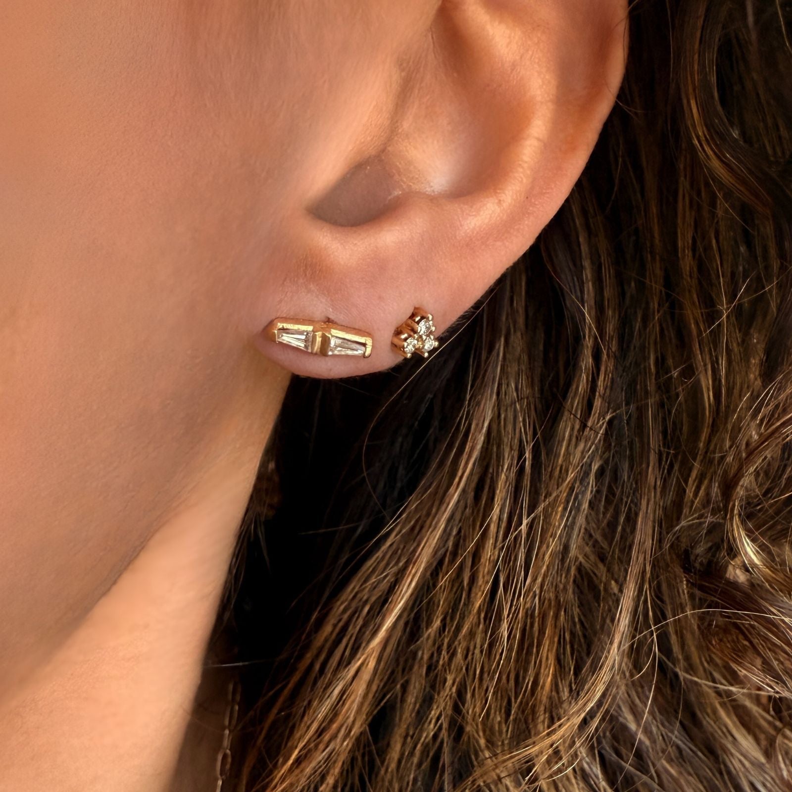 14K yellow gold tapered baguette diamond stud earrings on a model- Camille Jewelry