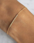Diamond Bar Bracelet – 14K yellow Gold Pavé Fine Jewelry on models arm by Camille Jewelry