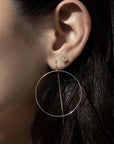 Small Diamond Stud Earrings – 14K Yellow Gold Mini Trio Diamond on models ear by Camille Jewelry.