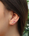 Model wearing Marquise Diamond Stud Earrings In Ruby - Camille Jewelry