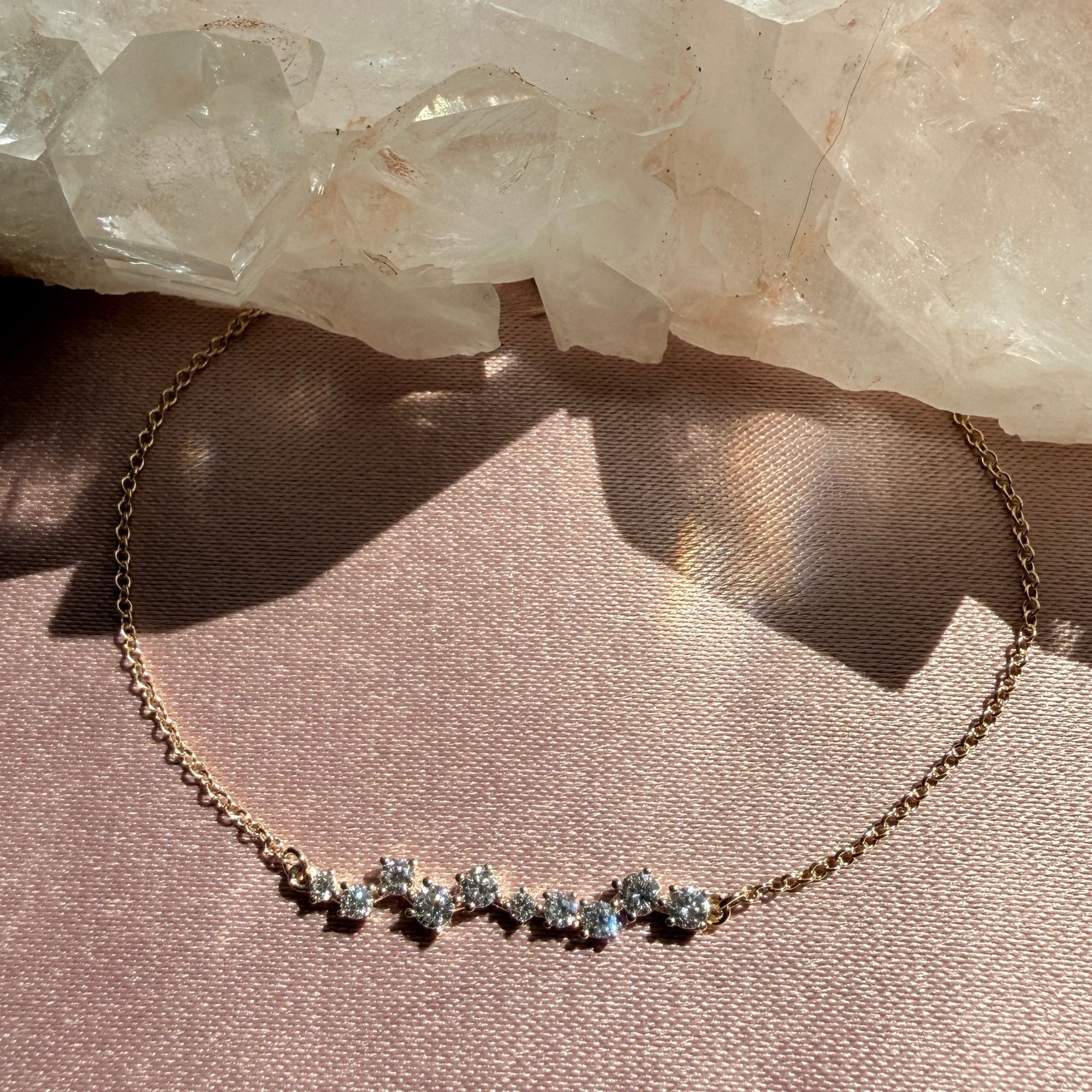 14k yellow Gold constellation lab created diamond bracelet on dusty pink background - Camille Jewelry